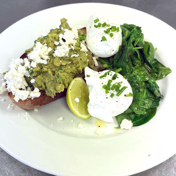 Poached eggs with smashed avocado & spinach